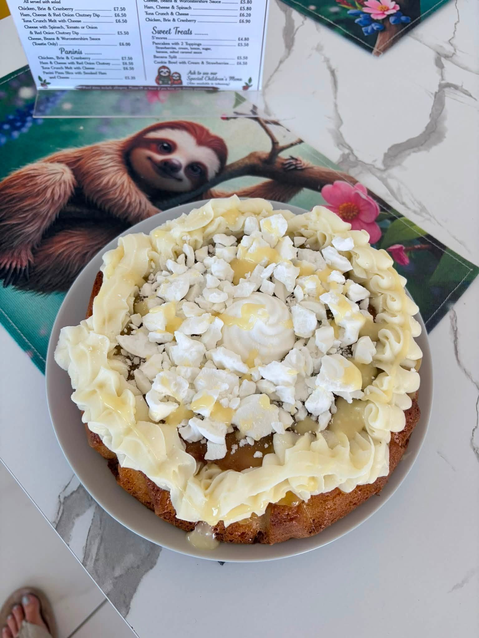 Celebration cake with cream and meringue at The Sloffee Shop